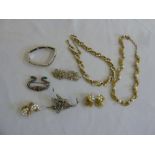 A quantity of costume jewellery to include a silver bracelet and a 19th century paste brooch