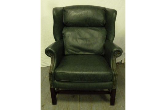 Green leather high back armchair on rectangular legs