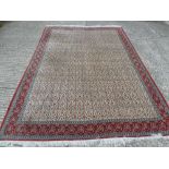 Persian wool carpet with geometric repeating patterns in creams, blues and maroons - 325 x 230cm