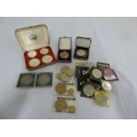 Quantity of coins to include a cased set of silver Olympic coins, an American Eagle silver coin