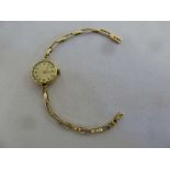 Rotary 9ct gold ladies wristwatch on 9ct gold bracelet, approx total weight 13.9g