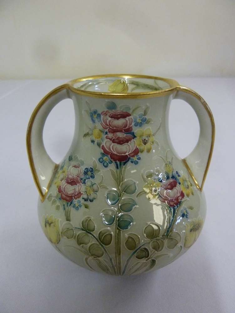 Moorcroft two handled vase decorated with roses, tulips and forget-me-knots circa 1907, signed