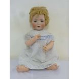 A bisque head doll Baby Vivian, in appropriate dolls dress