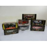 A quantity of 1:18 and 1:24 scale model cars in original packaging to include Burago (7)