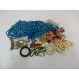 A quantity of costume jewellery to include bangles, beaded necklaces and accessories