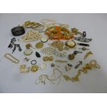 A quantity of costume jewellery to include brooches, earrings and bangles