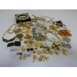 A quantity of costume jewellery to include necklaces, rings , earrings, chains and brooches