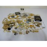 A quantity of costume jewellery to include necklaces, earrings, brooches, rings and chains