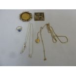 A quantity of jewellery to include necklaces, brooches and a ring