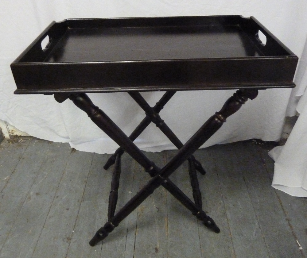 Ebonised butlers tray on hinged stand