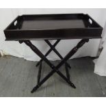 Ebonised butlers tray on hinged stand