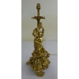 French gilt metal table lamp stand in the form of a figure on a shaped triform base