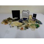 A quantity of costume jewellery to include necklaces, brooches, bangles, rings and earrings