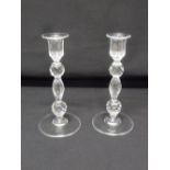 A pair of crystal table candlesticks, baluster form on circular bases