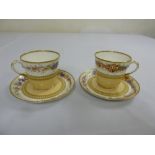 Pair of Royal Worcester cabinet cups and saucers