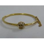 15ct gold bangle set with seed pearls and diamond, approx 7.2g