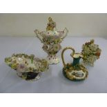 An English bocage vase and cover, a bocage bonbon dish, a bocage ornament and a Derby jug