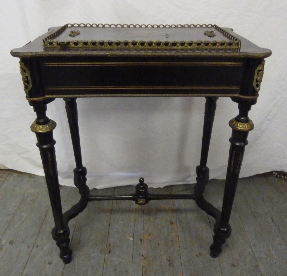 A 19th century French ebonised jardinière in the form of a table with brass inlay, gilt mounts and