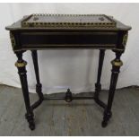 A 19th century French ebonised jardinière in the form of a table with brass inlay, gilt mounts and