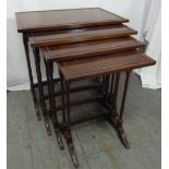 An Edwardian mahogany nest of four tables