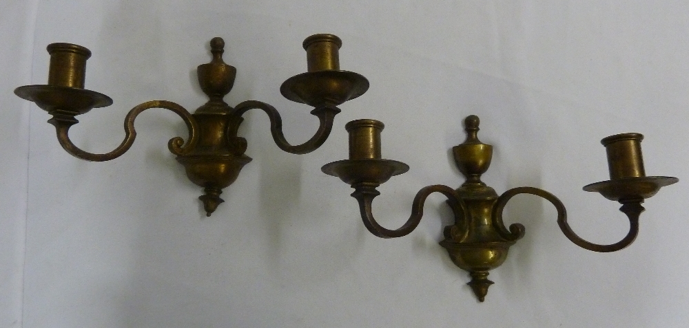 A pair of two branch bronze wall lights