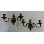 A pair of two branch bronze wall lights