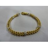 18ct gold double twist and diamond bracelet, approx 30.5g
