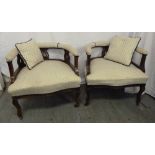 Pair of mahogany occasional armchairs, upholstered seats and original castors