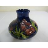 Moorcroft blue ground anemone vase, signed to base William Moorcroft