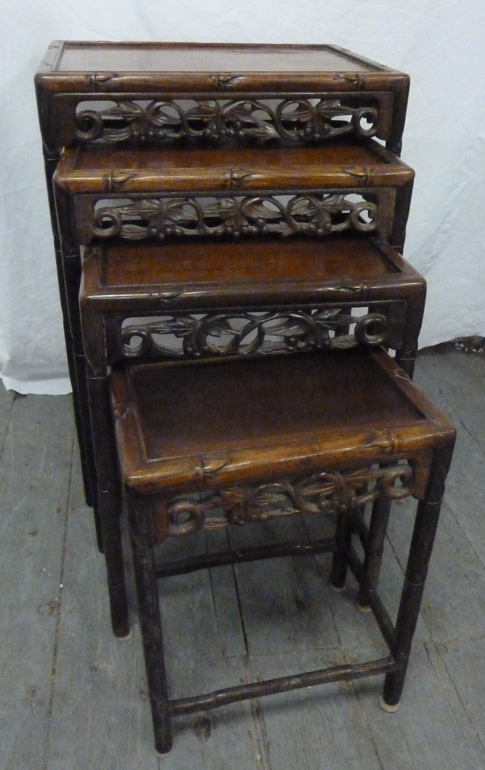 A 19th century Chinese nest of four tables