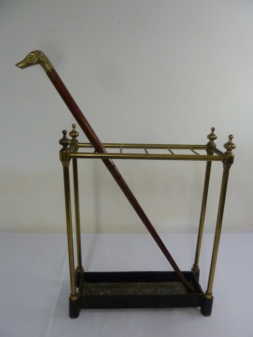 Victorian brass umbrella stand and a walking stick with brass handle