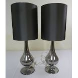 A pair of glass table lamps and shades