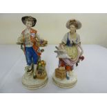 Pair of Continental porcelain figures of a lady and a man