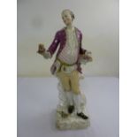 A 19th century Meissen figurine of a gentleman presenting flowers, 50cm(h), A/F