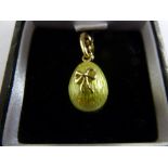 Faberge miniature green enamelled egg pendant, signed