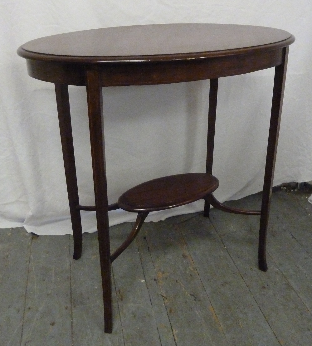 Edwardian mahogany oval side table on four tapering legs