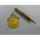 1913 half Sovereign set in a pendant and a gold telescopic toothpick