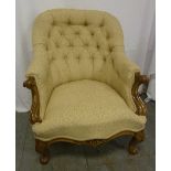Victorian button back upholstered armchair on four scroll legs