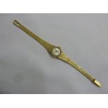 9ct yellow gold ladies wristwatch with diamond bezel and integral bracelet, approx 19.1g