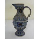 German salt glazed pottery jug with scroll  handle