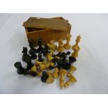 An early 20th century wooden chess set in original box