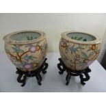 Two Chinese goldfish bowls on hardwood stands