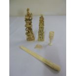 A quantity of early 20th century ivory and bone items to include carved figurines and paper knife