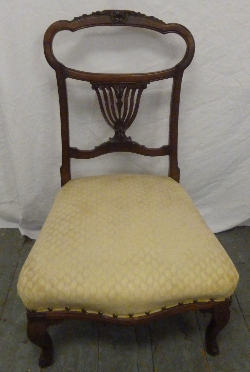 Victorian nursing chair on four cabriole legs
