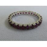 White gold and ruby eternity ring