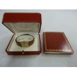 A Must de Cartier silver gilt ladies wrist watch with sapphire cabochon winder and leather strap,