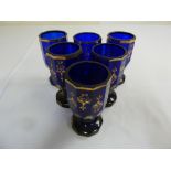 A set of six 19th century Bristol blue and gilt Bohemian goblets