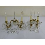 A pair of crystal and gilt metal wall lights