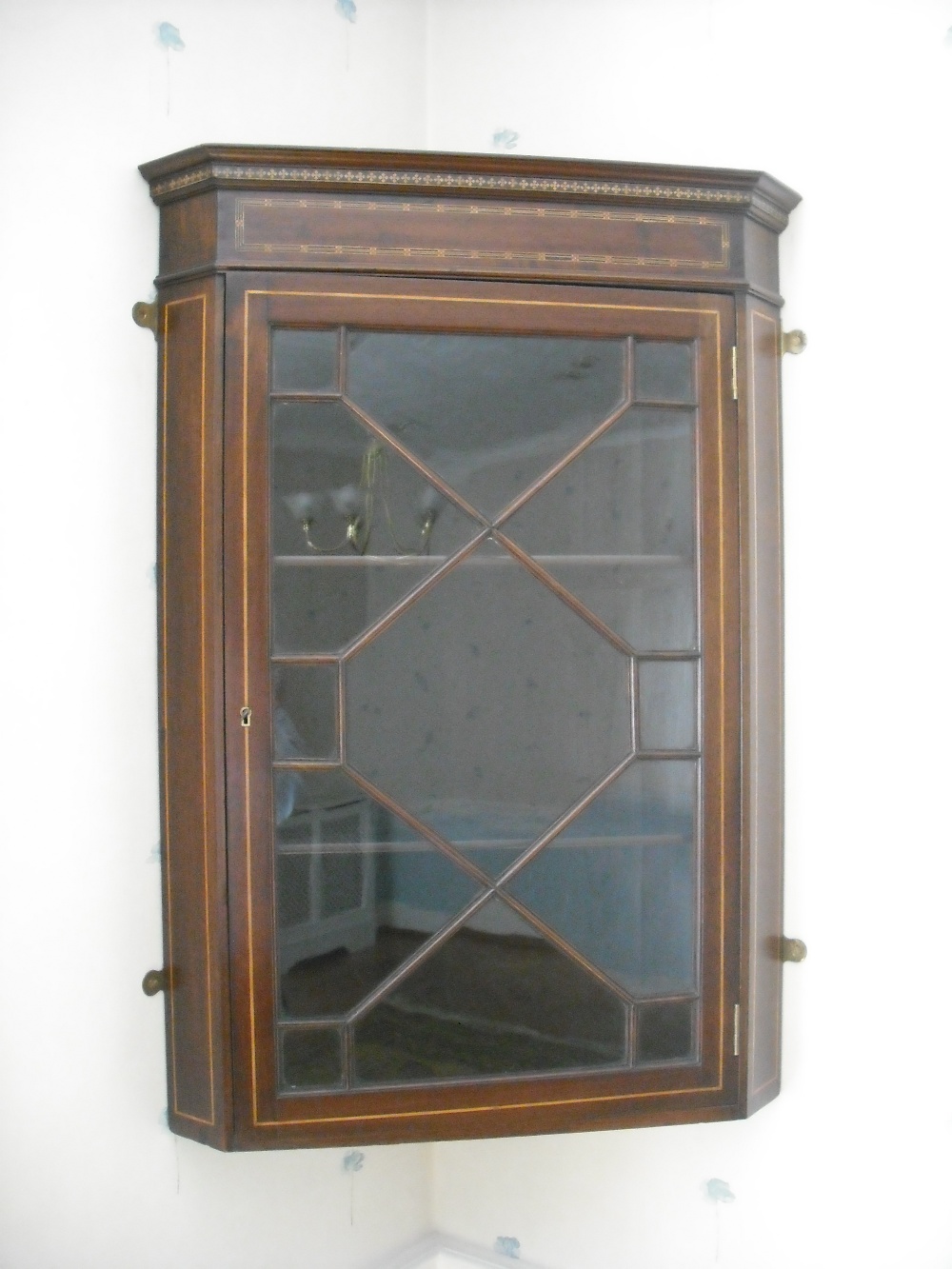 Edwardian mahogany and satinwood inlaid wall hanging cabinet, with astral glazed door