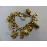 9ct gold charm bracelet with fifteen charms, approx 33.2g